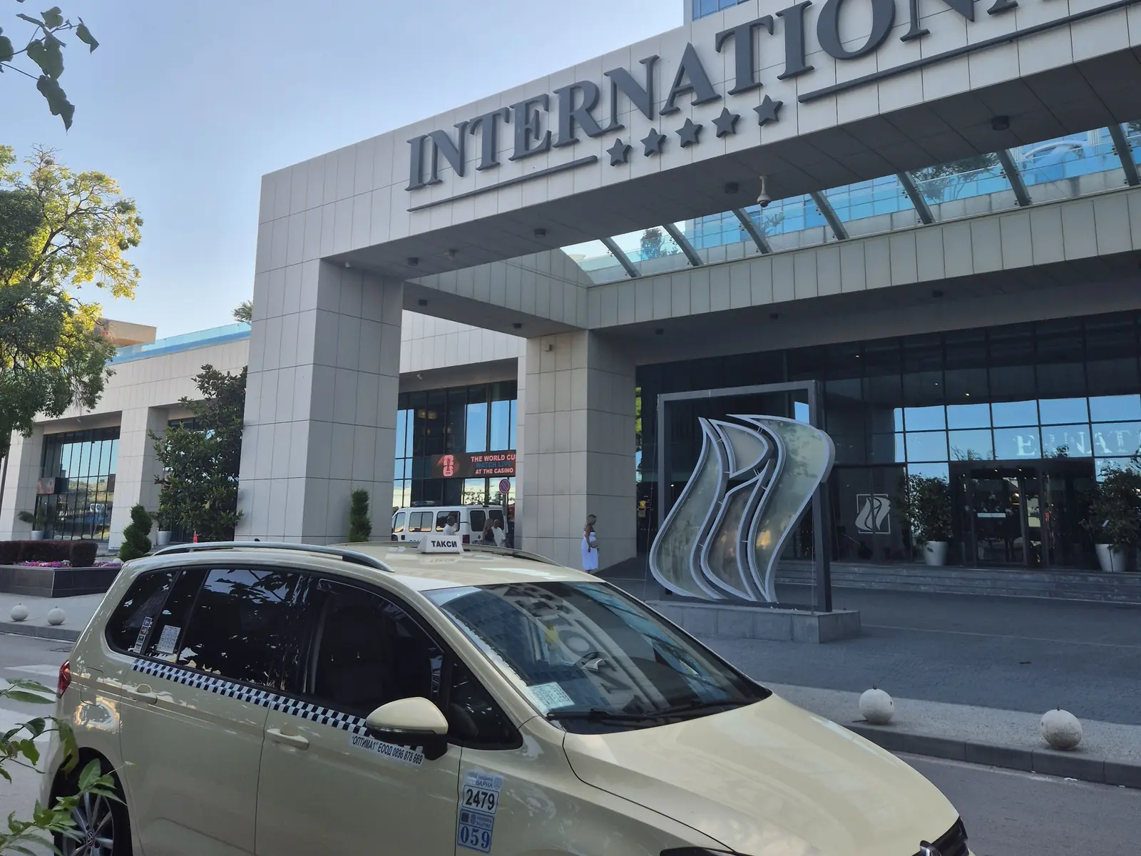 Taxi outside International Hotel in Golden Sands, seen from the side